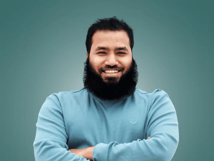 Saimul Islam smiling, arms crossed